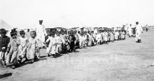 Primary school children attend the Sisvan School in the Port Said refugee camp