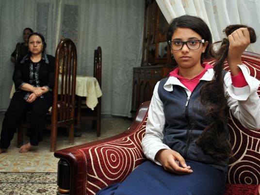 Women assault, cut hair of Christian woman on metro - Egypt Independent