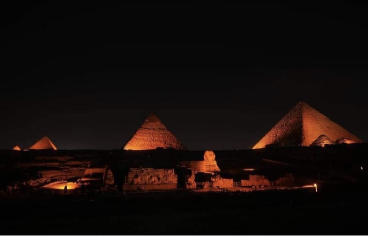 Giza pyramids light up in orange in solidarity with activists