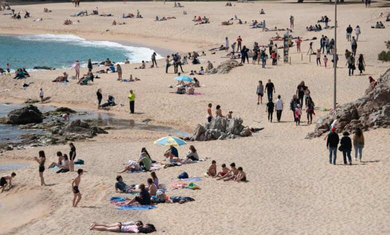 Tourists enjoying summer on the beach