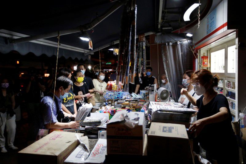 Two Apple Daily executives charged with collusion with foreign country