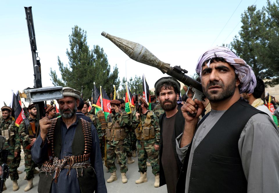 Afghan civilians take up arms as U.S.-led forces leave