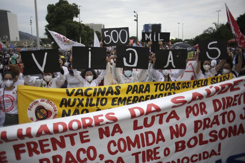 The Latest: Protests decry Brazil policies as toll tops 500K