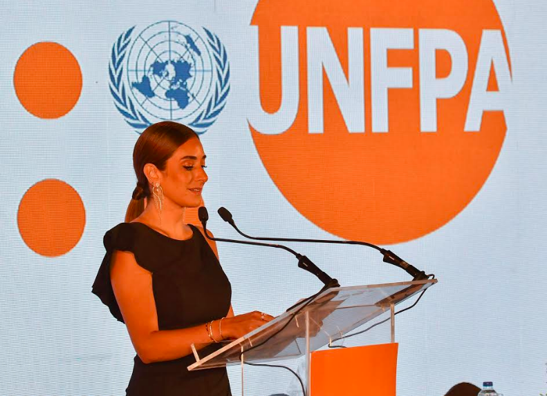 Actress Amina Khalil is giving a speech during a reception held to honor her as UNFPA ambassador.