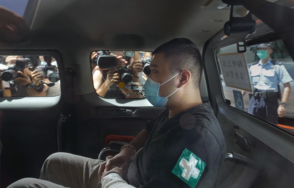 Hong Kong protester given 9-year term in 1st security case