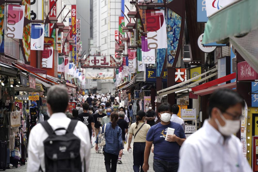 Japan expands virus emergency after record spikes amid Games