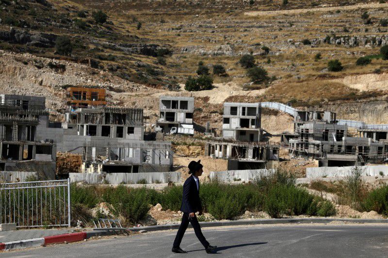 Israel to OK new homes for West Bank settlers, Palestinians -security official