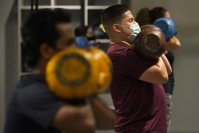 US hits 70 percent vaccination rate — a month late, amid a surge