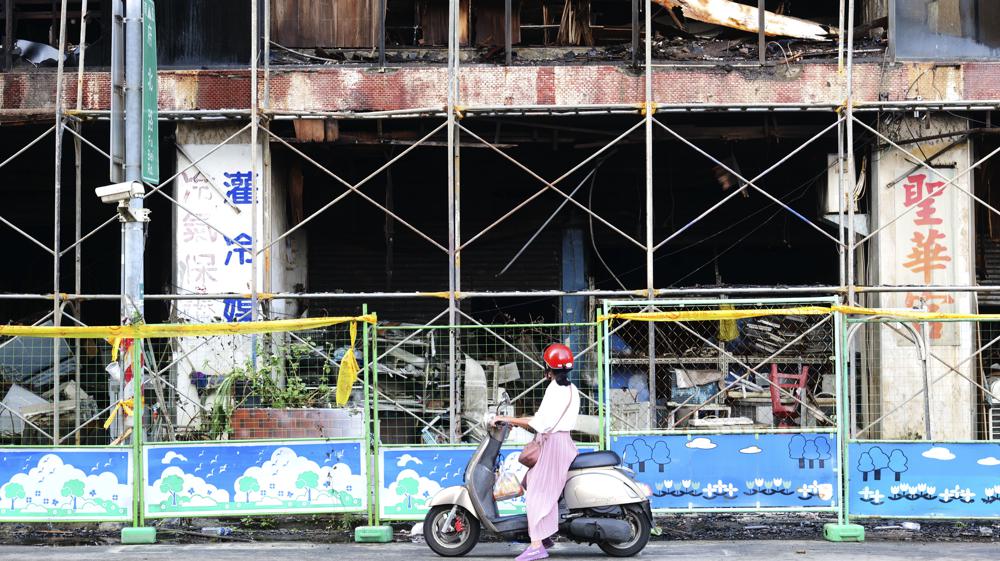 Officials seek cause of Taiwan building fire that killed 46 Officials seek cause of Taiwan building fire that killed 46