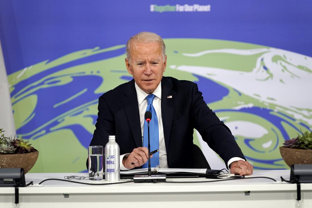 Troubles at home shadow Biden’s climate efforts abroad