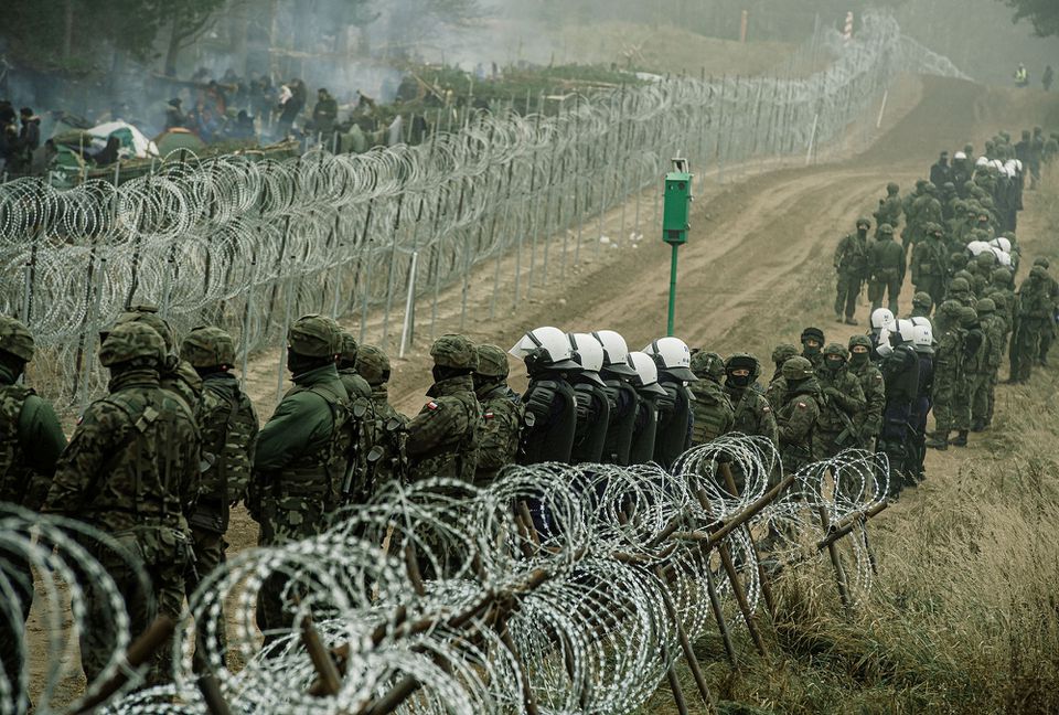 Polish police say group of 50 migrants broke through Belarus border