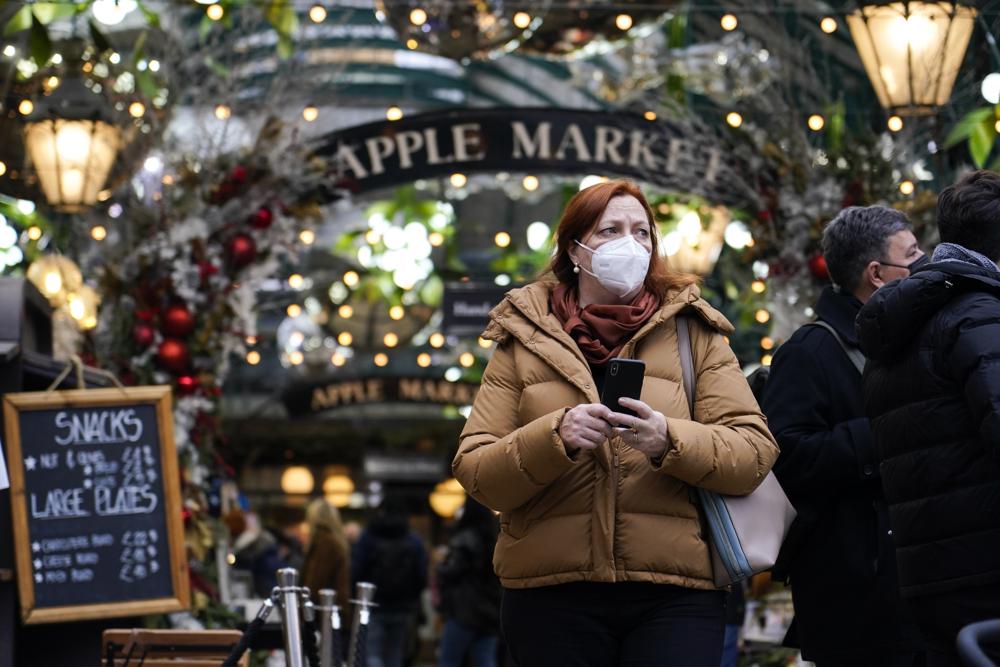 British surge seen as warning on omicron but responses vary