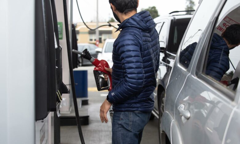 A customer refuels a vehicle at a Costco gas station.