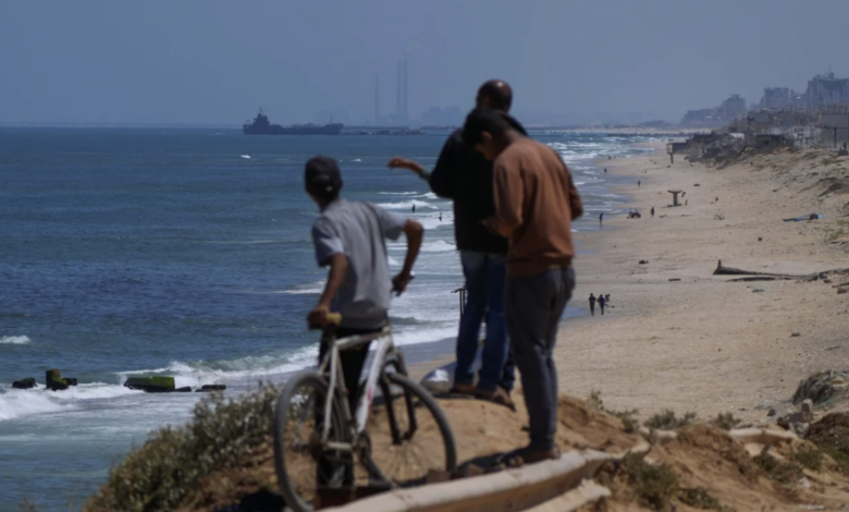 A ship is seen off the coast of Gaza near a US-built floating pier that will be used to facilitate aid deliveries on May 16, 2024. Abdel Kareem Hana/AP