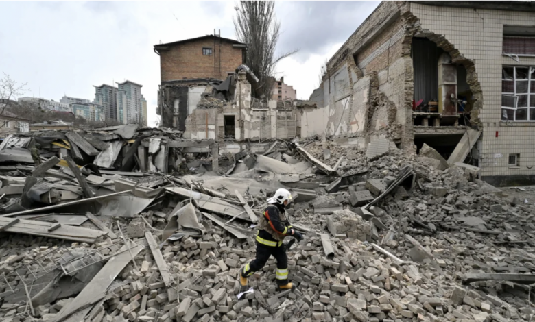 A Ukrainian rescuer works at the site of a missile attack in Kyiv, Ukraine on March 25, 2024. Sergi Supinsky/AFP/Getty Images