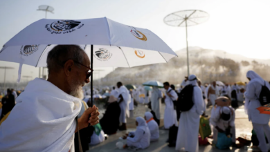 Muslim pilgrims hold umbrellas to shield from the glaring sun as they gather on the plain of Arafat during Hajj on June 15. Mohamad Torokman/Reuters