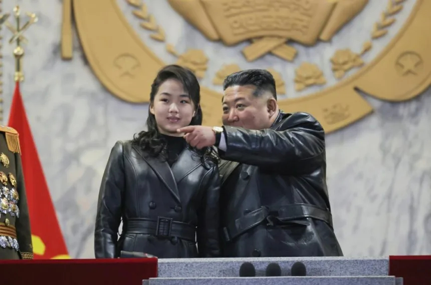 Kim Jong Un vows to strengthen nuclear program, watches military parade with daughter